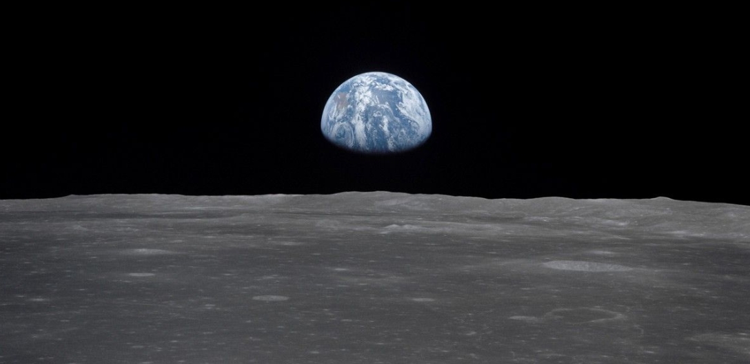 A wide-angle photograph of the lunar surface, showing its 'magnificent desolation'.