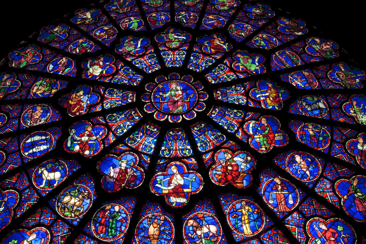 A cathedral rose window, symbolizing the RFP's focus on geometric, structural, and light-based symbolism over religious dogma.